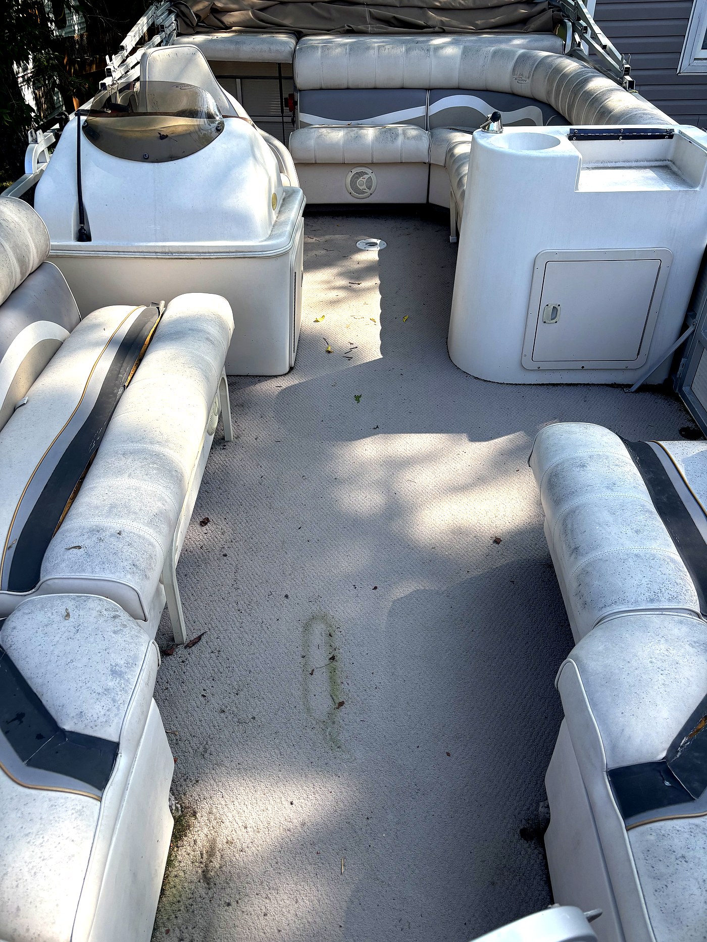 Pontoon boat before detailing North Bay — worn seats close up