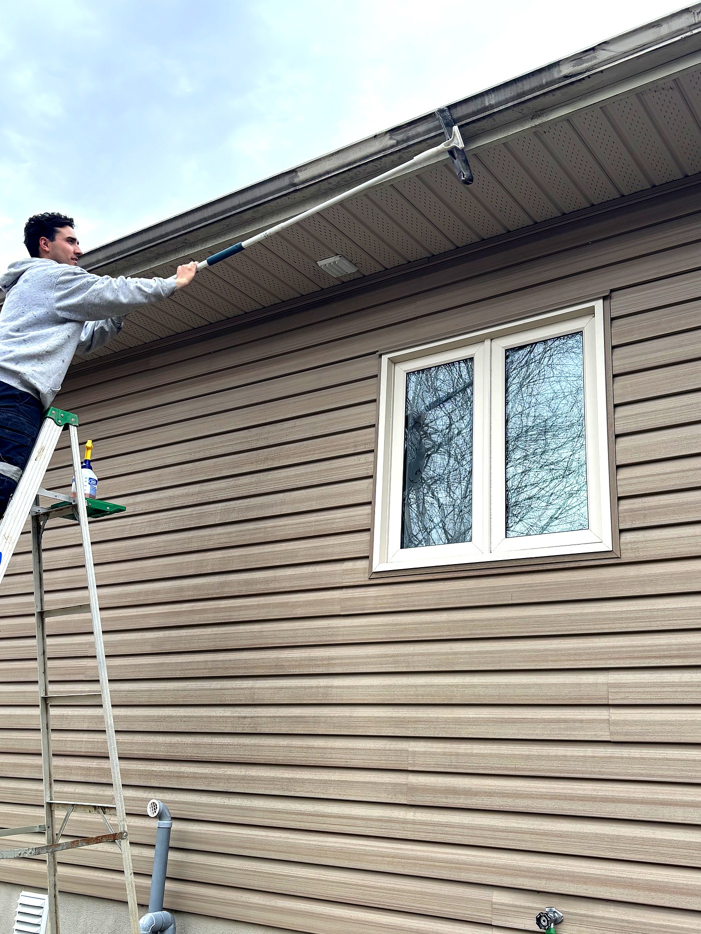 Gutter cleaning North Bay — Troy from Shine & Shine on ladder