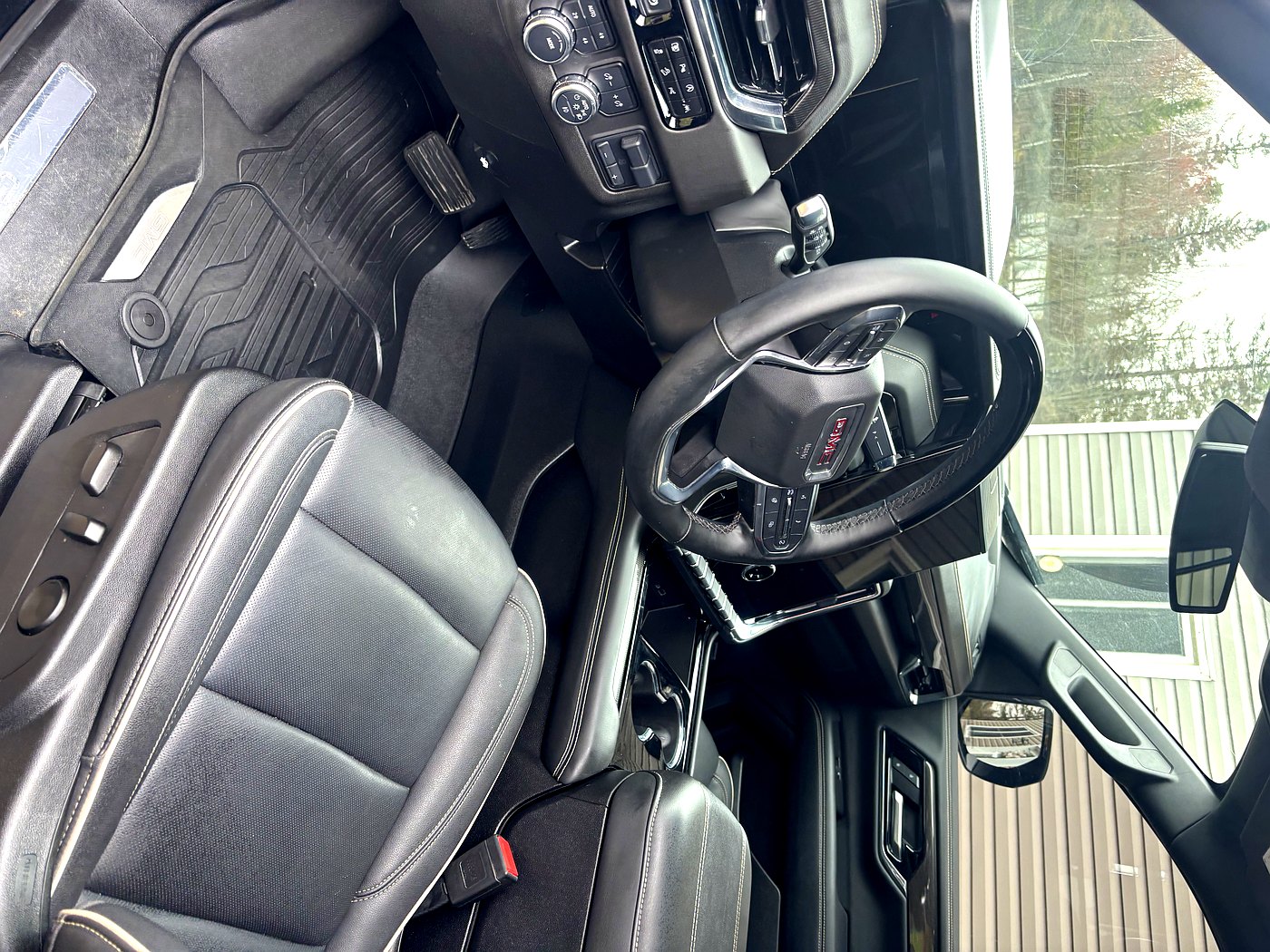 After GMC Sierra interior detail North Bay — clean driver side and steering wheel